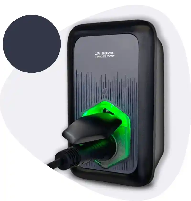 Wall-mounted electric vehicle charger with a black charging plug inserted and a green LED glow around the socket